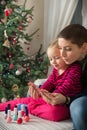 Mother and daughter having fun painting finger nails Royalty Free Stock Photo