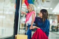 Mother and daughter in shopping mall toghether