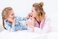 mother and daughter having fun and touching noses with fingers Royalty Free Stock Photo