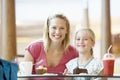 Mother And Daughter Having Lunch Together At Cafe Royalty Free Stock Photo