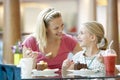 Mother And Daughter Having Lunch Together At Cafe Royalty Free Stock Photo