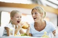 Mother And Daughter Having Lunch Together At Cafe Royalty Free Stock Photo