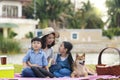 Mother and daughter having a picnic And playing with Shiba Inu puppies during the holidays Royalty Free Stock Photo