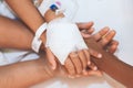 Mother and daughter holding hand who have IV solution bandaged together with love and care in hospital Royalty Free Stock Photo