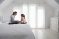 Mother And Daughter Holding Hands On Bed Royalty Free Stock Photo