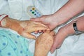 Mother Daughter Holding Hands in Hospital