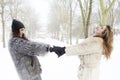 Mother and daughter holding hands in the snow Royalty Free Stock Photo