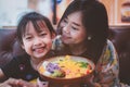 Mother and daughter holding a plate with a variety of salads for a healthy meal. Family and vegetable eating concept Royalty Free Stock Photo