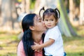 Mother and daughter are hug and kiss. Family is Thailand. Royalty Free Stock Photo