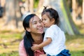 Mother and daughter are hug and kiss. Family is Thailand. Royalty Free Stock Photo