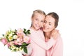 mother and daughter hugging and holding bouquet of flowers for mothers day, Royalty Free Stock Photo