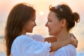 Portrait of a mother and daughter standing on seashore Royalty Free Stock Photo