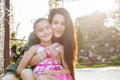 Mother and daughter hugging and smiling with closen eyes Royalty Free Stock Photo