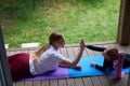 Mother and daughter interchanging high-five after successful sports exercises