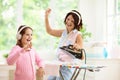 Woman ironing clothes. Home chores