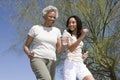 Mother And Daughter Jogging Together