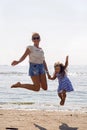 Mother and daughter jumping Royalty Free Stock Photo