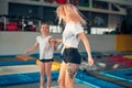 Mother and daughter jumping on trampoline and doing split Royalty Free Stock Photo