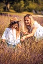 Mother and daughter in lavender field