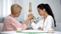 Mother and daughter-in-law looking on each other during arm wrestling battle Royalty Free Stock Photo