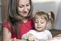 Mother And Daughter Learning At Home