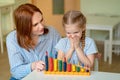 Mother with daughter learning to add and subtract