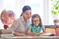 Mother and daughter are learning to write Royalty Free Stock Photo