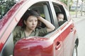 Mother and Daughter Looking Frustrated Out the Window of a Car Royalty Free Stock Photo