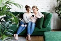 Mother and daughter love. Adult woman and young woman stacking hands in heart sign looking at camera. Royalty Free Stock Photo