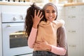 Mother Daughter Love. Beautiful Muslim Lady In Hijab Embracing Her Little Child Royalty Free Stock Photo