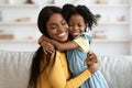 Mother Daughter Love. Happy Black Woman Hugging With Her Child At Home Royalty Free Stock Photo