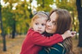 mother daughter love hug at autumn city park Royalty Free Stock Photo