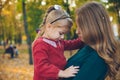 mother daughter love hug at autumn city park Royalty Free Stock Photo