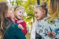 mother daughter love hug at autumn city park Royalty Free Stock Photo