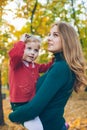 mother daughter love hug at autumn city park Royalty Free Stock Photo