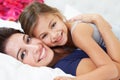 Mother And Daughter Lying In Bed Together Royalty Free Stock Photo