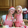 Mother and daughter making chrtistmas cookies Royalty Free Stock Photo