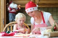 Mother and daughter making chrtistmas cookies Royalty Free Stock Photo