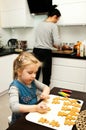 Mother and daughter making gingerbread cookies at home Royalty Free Stock Photo