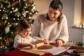 mother and daughter making gingerbread at home Royalty Free Stock Photo