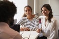 Mother And Daughter Meeting With Male Teacher