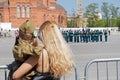 Mother and daughter in a military uniform watching dress rehearsal of the military parade in honor of Victory day in Volgograd Royalty Free Stock Photo