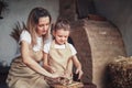 mother and daughter mold with clay, enjoying pottery art and pro