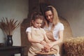 mother and daughter mold with clay, enjoying pottery art and pro