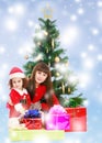 Mother with daughter near the Christmas tree Royalty Free Stock Photo