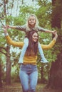 Mother and daughter outdoors in a meadow. Royalty Free Stock Photo