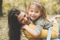 Mother and daughter outdoors in a meadow. Royalty Free Stock Photo