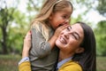 Mother and daughter outdoors in a meadow. Royalty Free Stock Photo