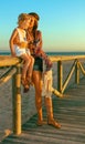 Mother and daughter outdoors in summer evening having fun time Royalty Free Stock Photo