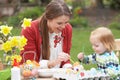 Mother And Daughter Painting Easter Eggs